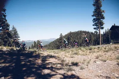 a group of people riding bikes on a hill at Your Roomy Northstar Retreat Awaits in Truckee