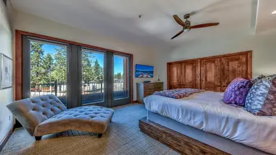 a bedroom with a bed and a large window at Luxury 3Br Residence Steps From Heavenly Village & Gondola Condo in South Lake Tahoe