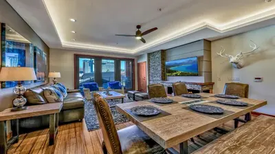 a dining room with a table and a couch at Luxury 3Br Residence Steps From Heavenly Village & Gondola Condo in South Lake Tahoe