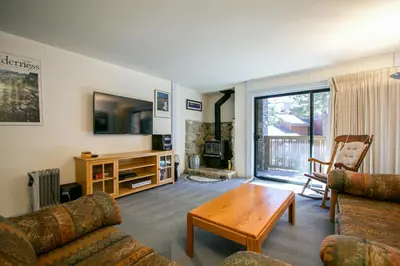 a living room with a couch and a table at Summit Condominium #41 Condo in Mammoth Lakes