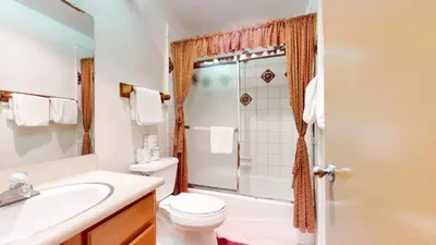 a bathroom with a toilet sink and a shower at Summit Condominium #267 Condo in Mammoth Lakes