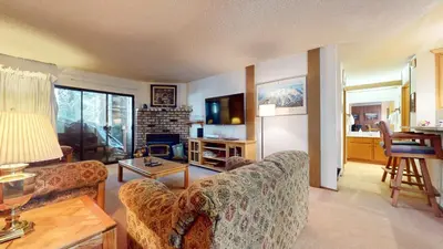 a living room with a couch and a tv at Summit Condominium #267 Condo in Mammoth Lakes