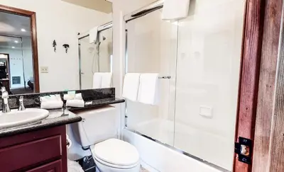 a bathroom with a toilet and a shower and a sink at Helios North #5 Condo in Mammoth Lakes