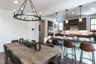 a dining room and kitchen with a table and chairs at Creekhouse 1320 in Mammoth Lakes