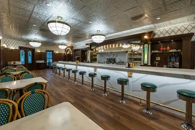 a bar with a row of stools in a restaurant at The Ranch At Death Valley in Death Valley