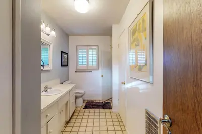 a bathroom with a sink and a toilet at Heart's Desire on the Lake (01-275) in Groveland