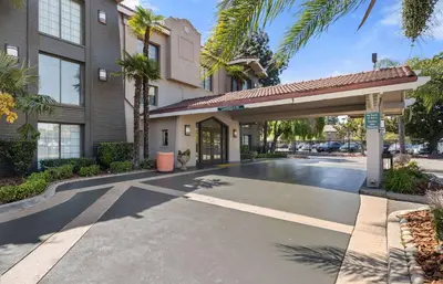 a parking lot in front of a building at La Quinta Inn by Wyndham Stockton in Stockton