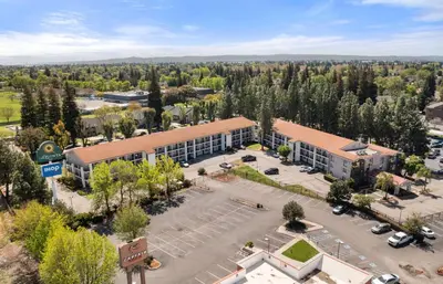 an overhead view of a building with a parking lot at La Quinta Inn by Wyndham Stockton in Stockton