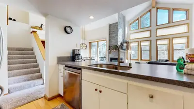 a kitchen with a sink and a counter top at Snowcreek 880 Condo in Mammoth Lakes
