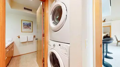 a laundry room with a washer and dryer at Snowcreek 880 Condo in Mammoth Lakes