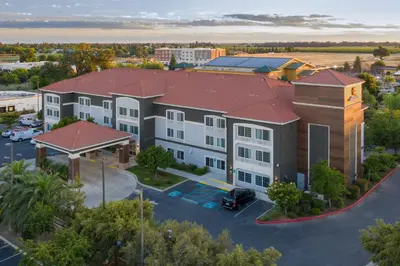 an overhead view of a building with a parking lot at La Quinta by Wyndham Visalia/Sequoia Gateway in Visalia