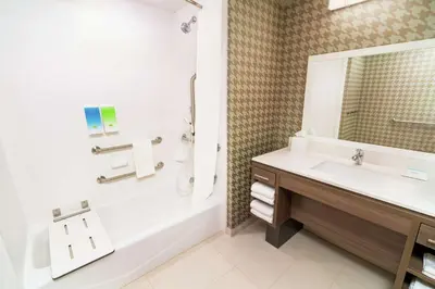 a bathroom with a sink and a tub and a shower at Home2 Suites By Hilton Roseville Sacramento in Roseville