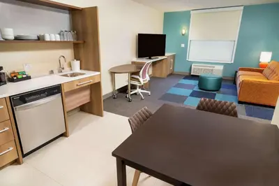 a room with a kitchen and a living room at Home2 Suites By Hilton Roseville Sacramento in Roseville