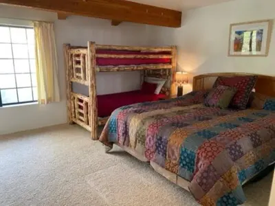 a bedroom with a large bed and a large window at Rr-interlaken 13 in June Lake