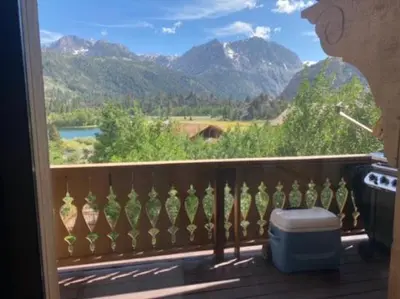a room with a balcony with a view of mountains at Rr-interlaken 13 in June Lake