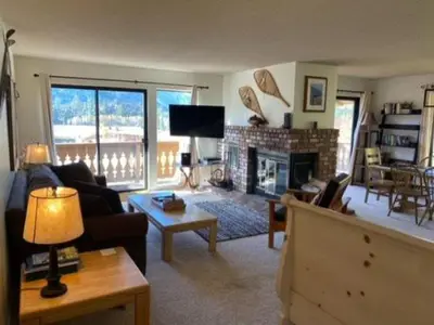 a living room with a couch and a fireplace at Rr-interlaken 13 in June Lake
