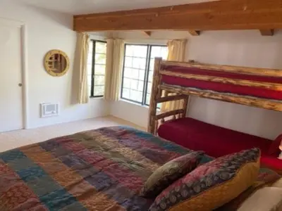 a bedroom with a bed and a bunk bed at Rr-interlaken 13 in June Lake