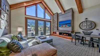 a living room with a couch and a table at Luxury 2Br Residence Steps From Heavenly Village & Gondola Condo in South Lake Tahoe
