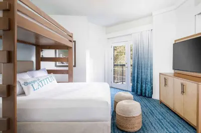 a hotel room with a bed and a television at Margaritaville Resort Lake Tahoe in South Lake Tahoe