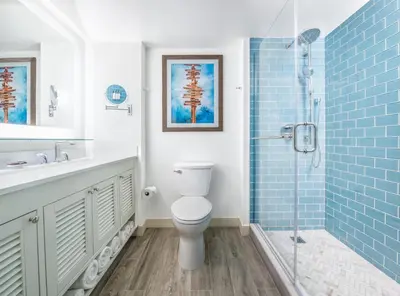 a bathroom with a toilet and a sink and a shower at Margaritaville Resort Lake Tahoe in South Lake Tahoe