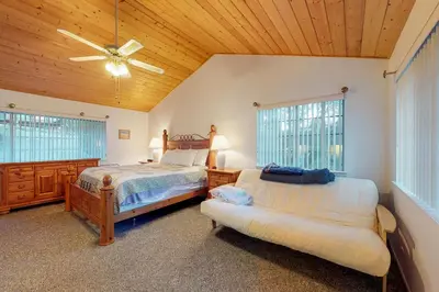 a bedroom with two beds and a ceiling fan at Escape to Yosemite in Groveland