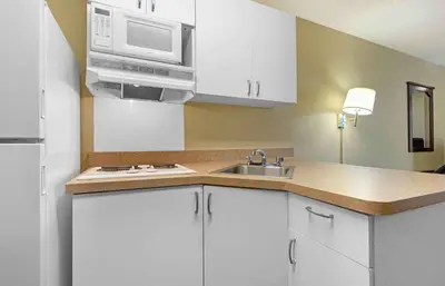 a kitchen with a sink and a microwave at Extended Stay America Suites - Reno - South Meadows in Reno