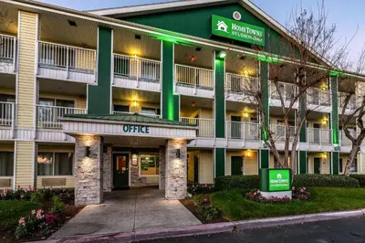 an image of the front of our hotel at HomeTowne Studios by Red Roof Fresno - West in Fresno