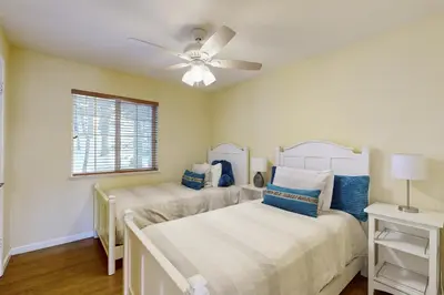 a bedroom with two beds and a ceiling fan at Welcoming Tahoe-Donner Cabin in Truckee