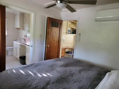 a bedroom with a bed and a sink and a kitchen at Becky's Condo in Mariposa