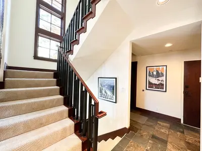 a staircase in a house with a window at Juniper Crest #25 Condo in Mammoth Lakes