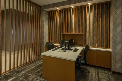 an office cubicle with a desk and chairs in it at SpringHill Suites by Marriott Reno in Reno