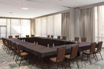 a large conference room with a long table and chairs at DoubleTree By Hilton Sacramento in Sacramento