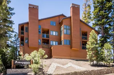 an apartment building with a sign in front of it at Mountainback 80 in Mammoth Lakes