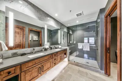 a bathroom with two sinks and a shower at Luxury 2Br Residence Steps From Heavenly Village & Gondola Condo in South Lake Tahoe