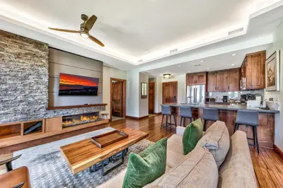 a living room with a couch and a fireplace at Luxury 2Br Residence Steps From Heavenly Village & Gondola Condo in South Lake Tahoe