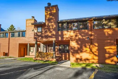 a building with a shadow on the side of it at Mammoth Village Properties by 101 Great Escapes in Mammoth Lakes