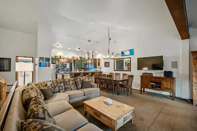 a living room with a couch and a table at Mammoth Village Properties by 101 Great Escapes in Mammoth Lakes