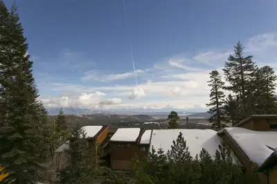a view of snow covered roofs of houses and trees at Timber Ridge Resort by 101 Great Escapes in Mammoth Lakes