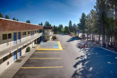an empty parking lot in front of a building at Motel 6-Mammoth Lakes, CA in Mammoth Lakes