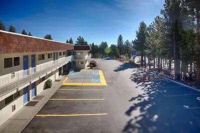 an empty parking lot in front of a building at Motel 6-Mammoth Lakes, CA in Mammoth Lakes