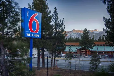 a sign for a wiltire gas station in a parking lot at Motel 6-Mammoth Lakes, CA in Mammoth Lakes