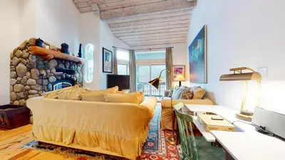 a living room with a couch and a fireplace at Snowcreek Iii #420 Condo in Mammoth Lakes