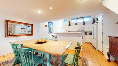 a kitchen and dining room with a wooden table and chairs at Snowcreek Iii #420 Condo in Mammoth Lakes