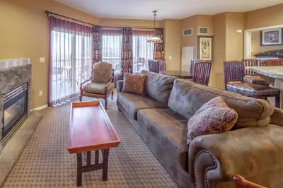 a living room with a couch and a table at Holiday Inn Club Vacations - David Walley's Resort in Genoa