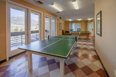 a room with a ping pong table in it at Holiday Inn Club Vacations - David Walley's Resort in Genoa