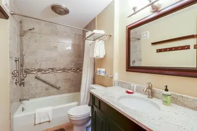 a bathroom with a sink and a tub and a toilet at Chateau Blanc 23 in Mammoth Lakes