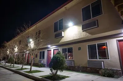 a building with lights on the side of it at night at Quality Inn Bishop near Mammoth in Bishop
