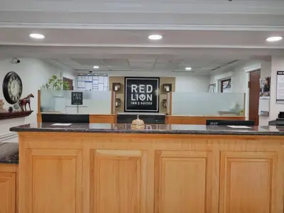 a bar in a hospital with a red lion sign on it at Red Lion Inn & Suites Auburn in Auburn
