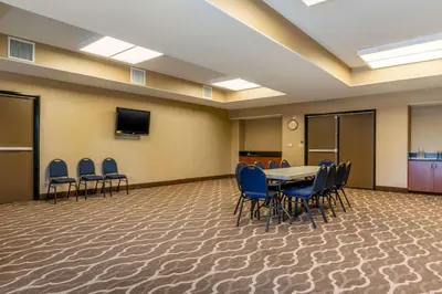 a conference room with a table and chairs and a tv at Comfort Inn & Suites Galt - Lodi North in Galt