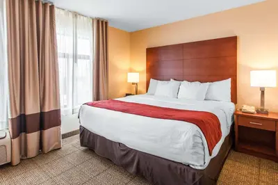 a hotel room with a large bed and a window at Comfort Inn & Suites Near Fallon Naval Air Station in Fallon